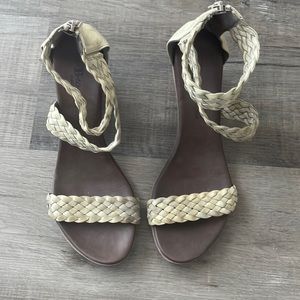 A pair of women's sandals in a cream colour. Worn a few times
